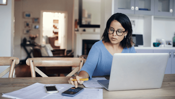 3_woman_home_laptop_calculators